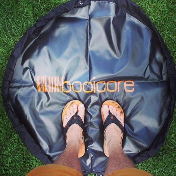a swimmer standing on the booicore changing mat he used to stand on to get changed out of his swim gear