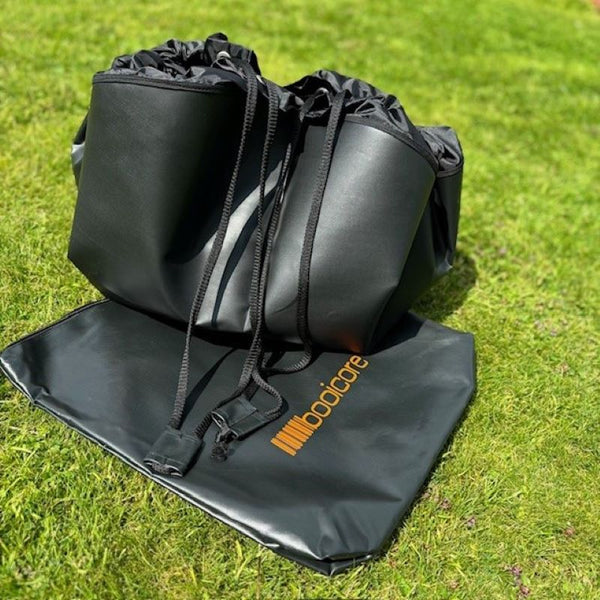 booicore change dirt mat filled with dirty gear after toggles pulled together to make the mat a drawstring bag to keep wet gear away from your dry items