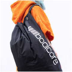 close up of black dirtbag sport bag travel on uk dry robe cotton poncho
