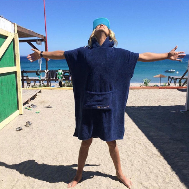 man wearing boociore changing robe navy blue on beach