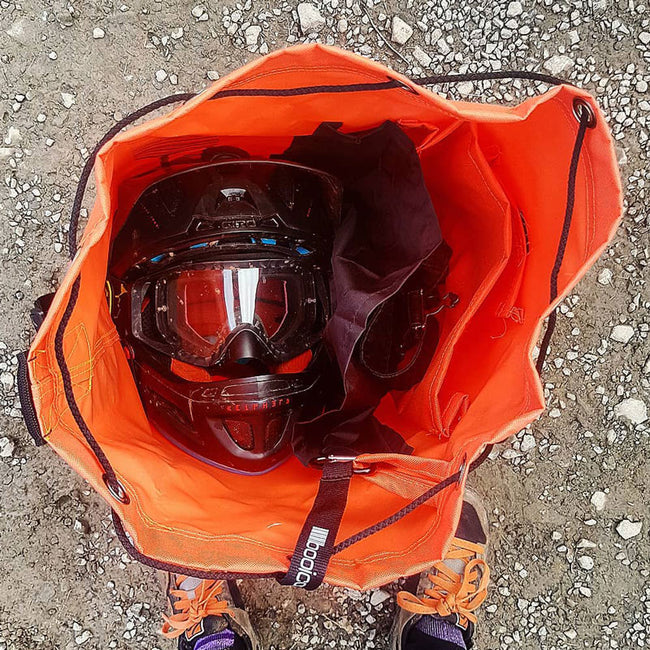 booicore dirtbag orange with a mountain bike helmet inside