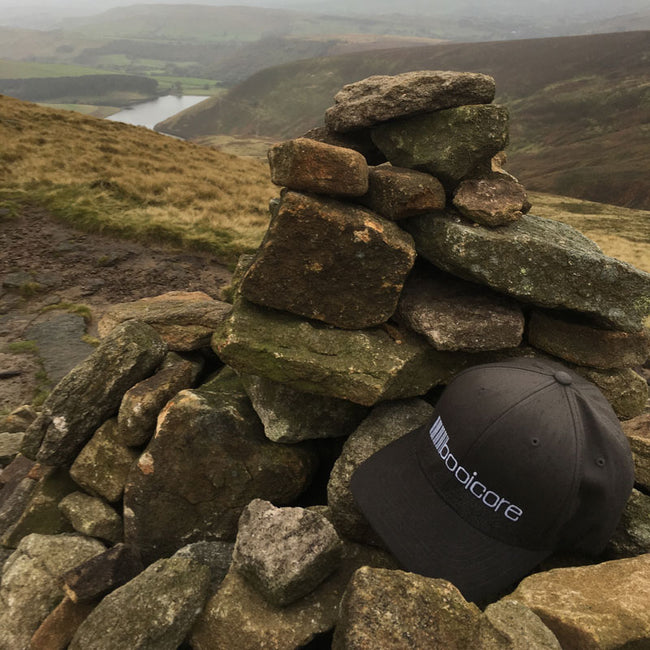 booicore baseball cap on a mountain top