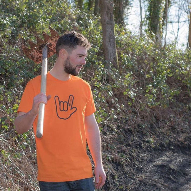 man standing in wood wearing orange booicore classic hand horn tee