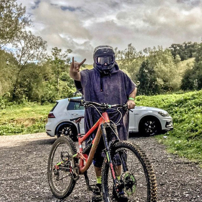 mountain biker with helmet on wearing booicore changing robe British Grey