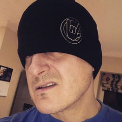 mountain bike wearing the black casual versatile warm beanie after a ride