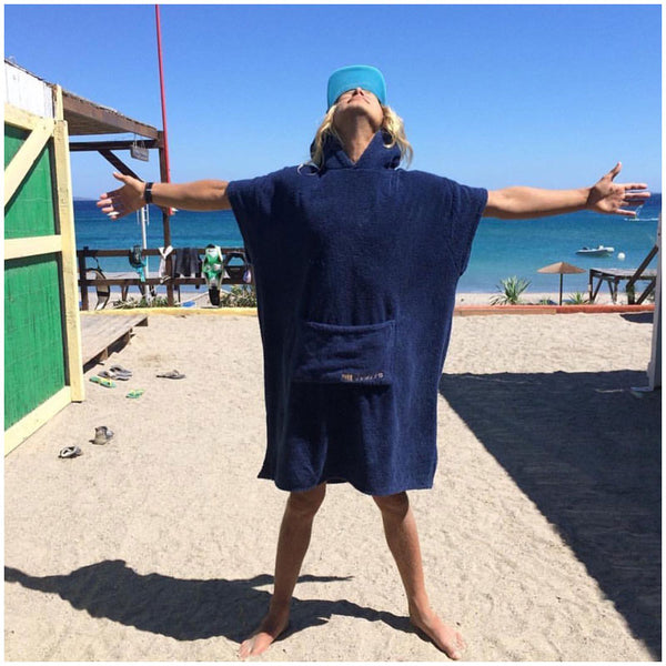 Man in baseball cap wearing booicore outdoor cotton towel robe after swimming