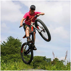 mtb mountain biker showing skills wearing black baseball cap