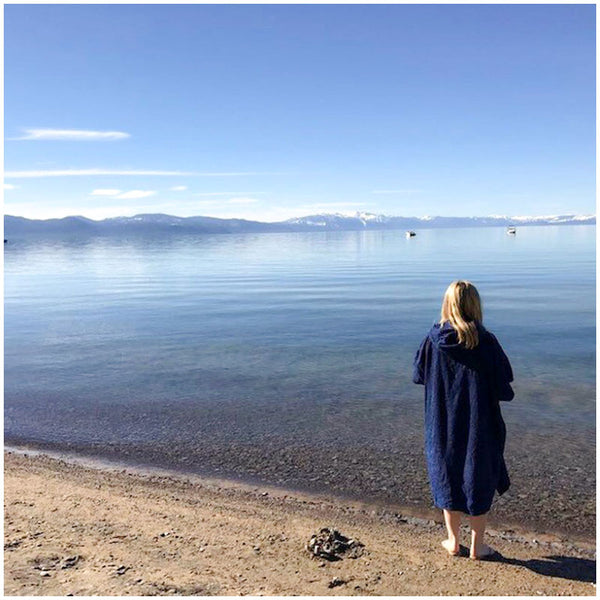 blonde woman outdoor swimming wearing a navy booicore dry change towel robe