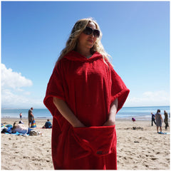 woman wearing shades on the beach wearing booicore cotton robe after swimming