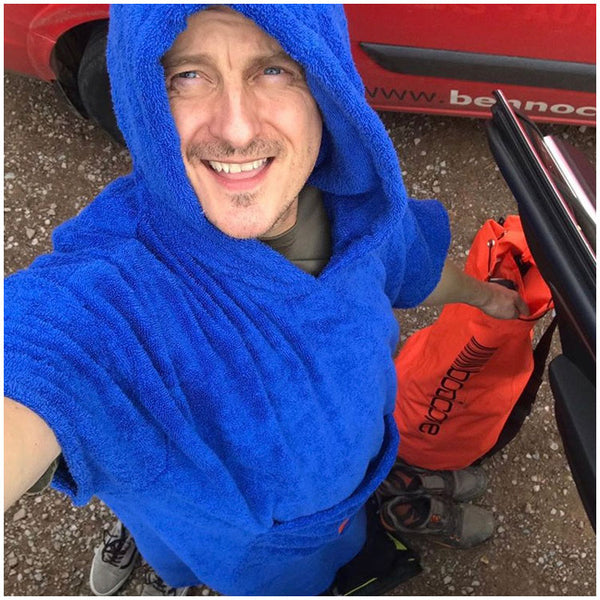 Mountain biker in Royal Blue booicore change robe with Bright Orange dirtbag