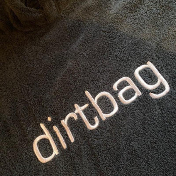 dirtbag embroidery on front of black dry robe cotton towel from booicore